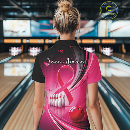 Back view of a female model in a black and pink bowling quarter zip featuring breast cancer awareness ribbons and bowling graphics