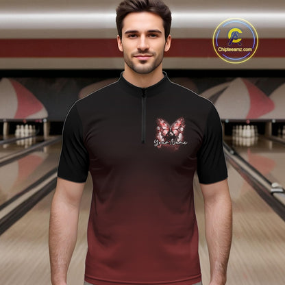 Male model at a bowling lane wearing a red bowling quarter-zip shirt with glowing butterfly artwork and a cosmic bowling theme.