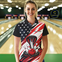 Load image into Gallery viewer, A woman stands in a bowling alley wearing a black, white, and red bowling shirt with stars, diagonal stripes, a cobra, pins, and an red ball.