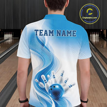 Load image into Gallery viewer, Back view of a male model wearing a white and blue bowling polo shirt featuring flowing wave artwork and a glossy bowling strike graphic in a bowling alley
