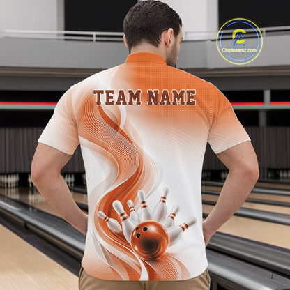 Male model in a bowling alley wearing a white and orange bowling quarter-zip shirt with dynamic wave patterns and bowling pin action imagery