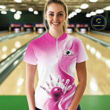 Load image into Gallery viewer, Female model wearing a white and pink bowling quarter zip with flowing abstract wave accents and a glossy bowling ball striking pins at the bowling lane
