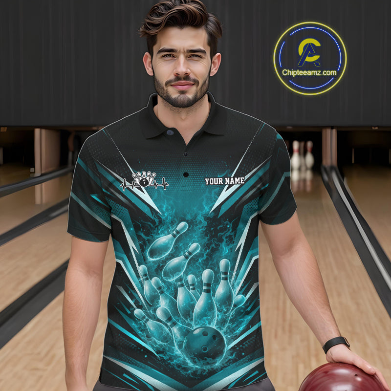 Male model at a bowling lane wearing a black and turquoise blue polo featuring explosive fire burst bowling graphics.