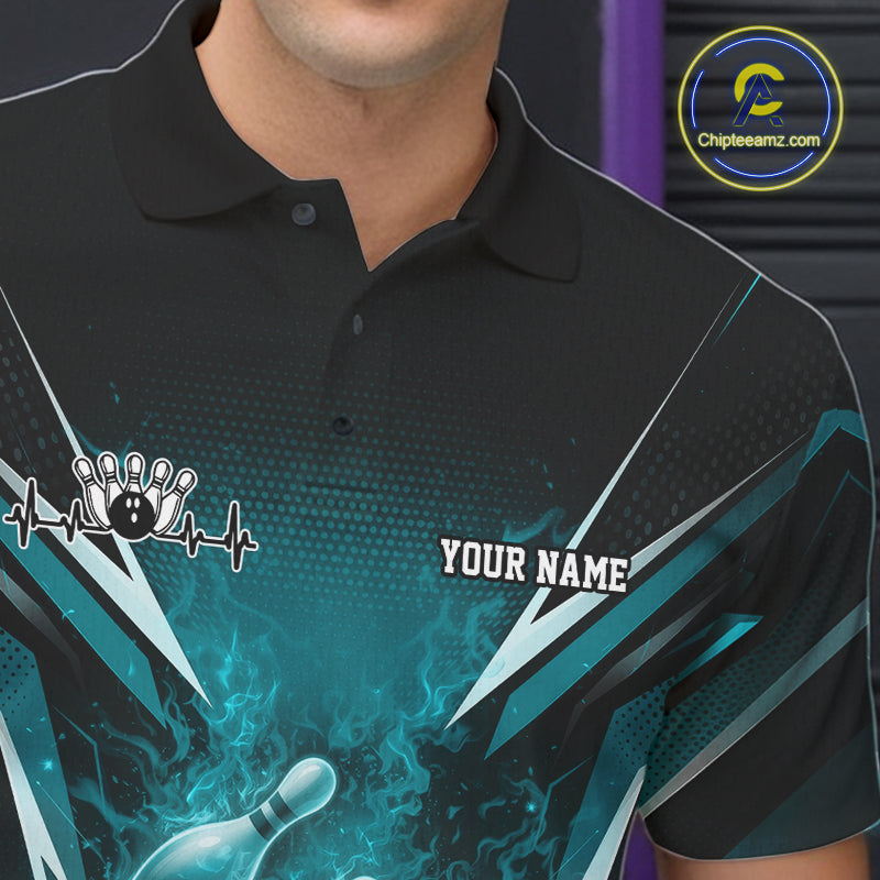 Left chest detail of a black and turquoise blue bowling polo showcasing a flaming bowling ball motif.