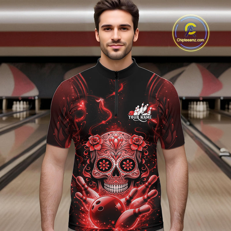 Male model wearing a black and red bowling quarter-zip shirt at a bowling lane with Day of the Dead-inspired sugar skull and bowling graphics.