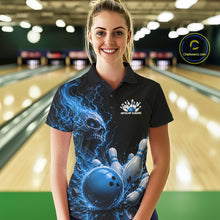 Load image into Gallery viewer, Front view of a female model in a bowling alley wearing a black bowling polo with a blue flaming skull, lightning, bowling pins, and a custom name.
