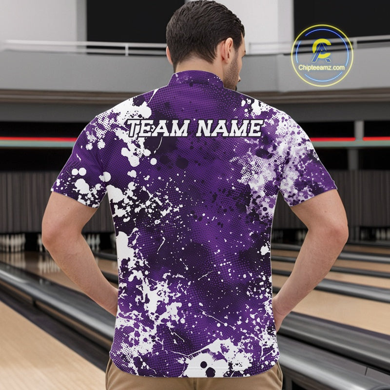 Man wearing a purple and white patterned bowling shirt with 'TEAM NAME' text on a bowling alley background.