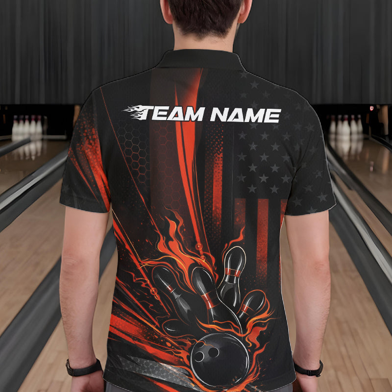 Back view of a male model in a bowling alley wearing a black and orange polo featuring a flaming bowling ball and pin impact design.