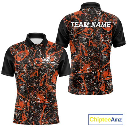 Front and back views of a black polo shirt with orange paint-splatter graphics, personalized with â€œYour Nameâ€ on the chest and â€œTeam Nameâ€ across the back.

