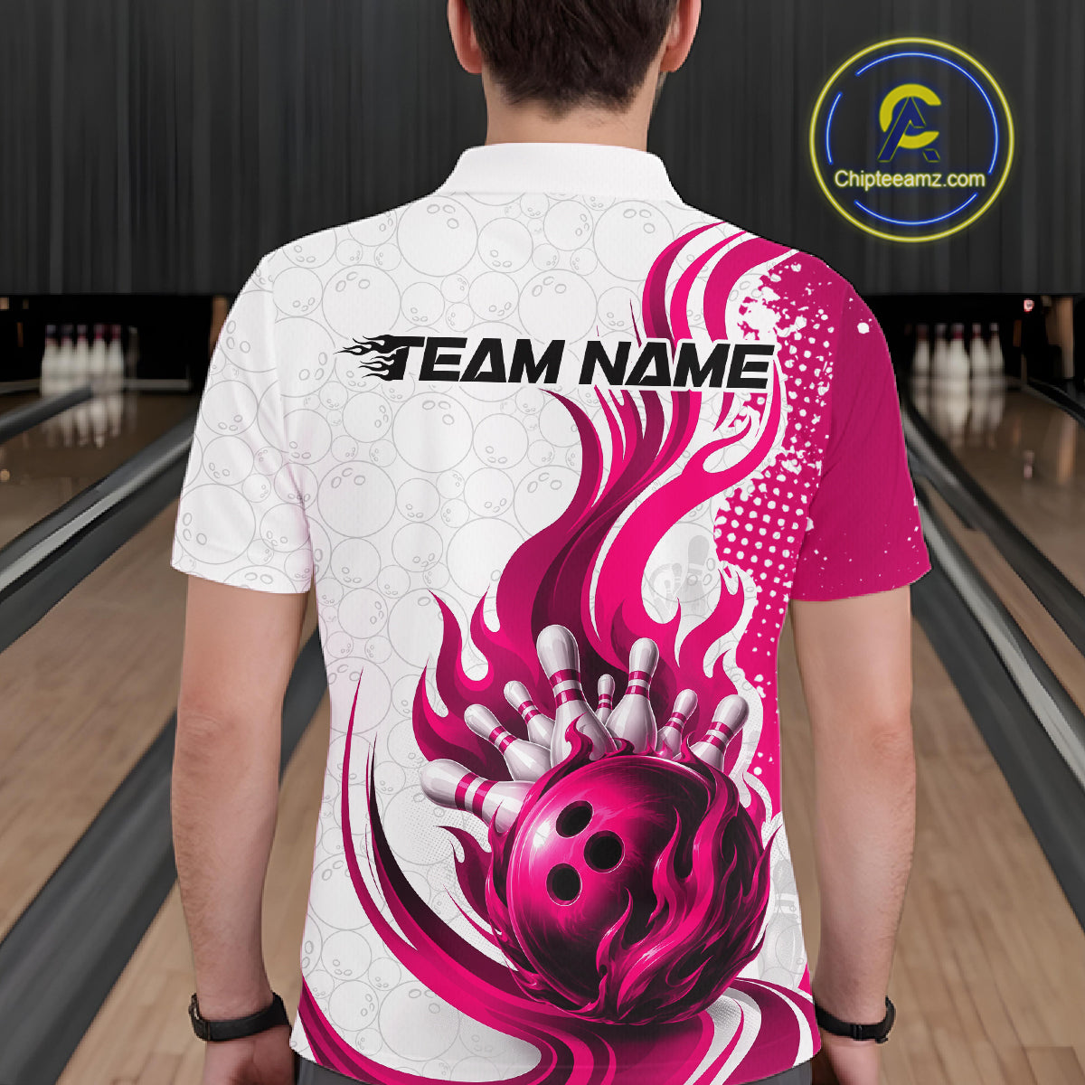 A man viewed from behind wearing a white bowling-themed short-sleeve shirt with a large pink and magenta flame graphic, bowling ball and pins design on the back, and 'TEAM NAME' placeholder text. 