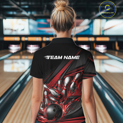 Female model in a bowling venue, back view of black polo shirt featuring red flame bowling ball and abstract geometric stripe artwork