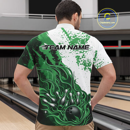 Front view of a male model in a bowling lane wearing a black quarter-zip shirt featuring black, green and white flame bowling ball and pins artwork with dynamic sports styling.