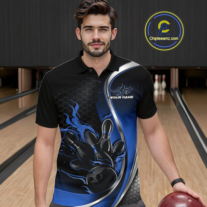 Male model seen from the front in a bowling lane wearing a black and blue polo shirt featuring a flame bowling ball striking pins in a dynamic sports scene.