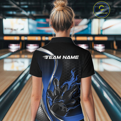 Female model back view at bowling lane wearing black and blue quarter zip shirt featuring flame bowling ball and pins action graphic