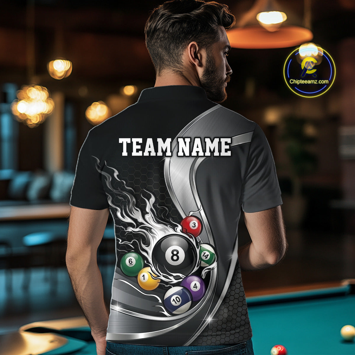 Back view of a male model wearing a black and silver billiard polo with metallic ribbons, dark honeycomb artwork, and scattered pool balls