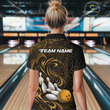Load image into Gallery viewer, Back view of a female model wearing a black and yellow bowling quarter-zip shirt in a bowling alley featuring a tribal flame bowling ball and pins graphic