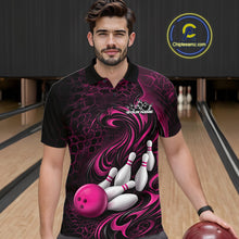 Load image into Gallery viewer, Male model wearing a black and pink bowling polo shirt in a bowling alley featuring a tribal flame bowling ball and pins graphic
