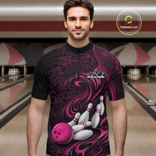 Load image into Gallery viewer, Male model standing in a bowling lane wearing a black and pink bowling quarter-zip shirt featuring a tribal flame bowling ball and pins graphic on the front.