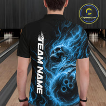 Load image into Gallery viewer, Back view of a male model wearing a black bowling polo shirt in a bowling alley featuring a skull clutching a bowling ball with swirling blue energy flames