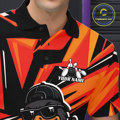 Close-up of the left chest on a black and orange bowling polo featuring duck, bowling ball, and pin artwork.