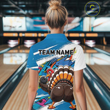 Load image into Gallery viewer, Back view of a female model in a bowling alley wearing a blue custom quarter zip bowling shirt with a funny graffiti turkey holding a bowling ball, paint splatter accents, and a personalized name.