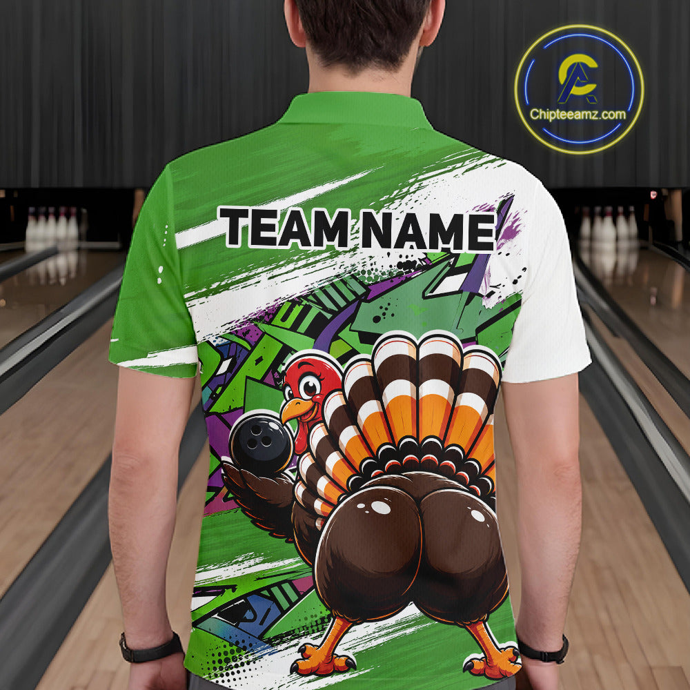 Back view of a male model wearing a green custom bowling polo shirt featuring a funny graffiti style turkey holding a bowling ball, paint splatter details, and a custom name in a bowling alley.