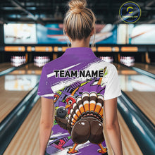 Load image into Gallery viewer, Back view of a female model wearing a purple custom bowling polo shirt with a funny graffiti turkey holding a bowling ball, paint splatter accents, and a personalized name in a bowling alley.