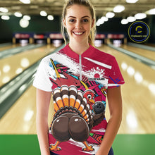 Load image into Gallery viewer, Front view of a happy female model in a bowling alley wearing a red custom quarter zip bowling shirt with a funny graffiti turkey holding a bowling ball, paint splatter accents, and a personalized name.