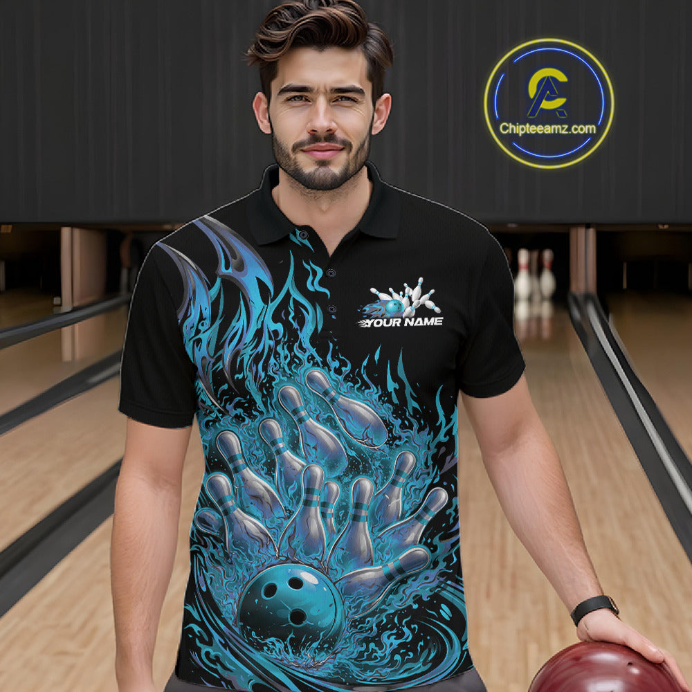 Male model in a bowling venue wearing a black and blue bowling polo decorated with blazing bowling strike artwork.