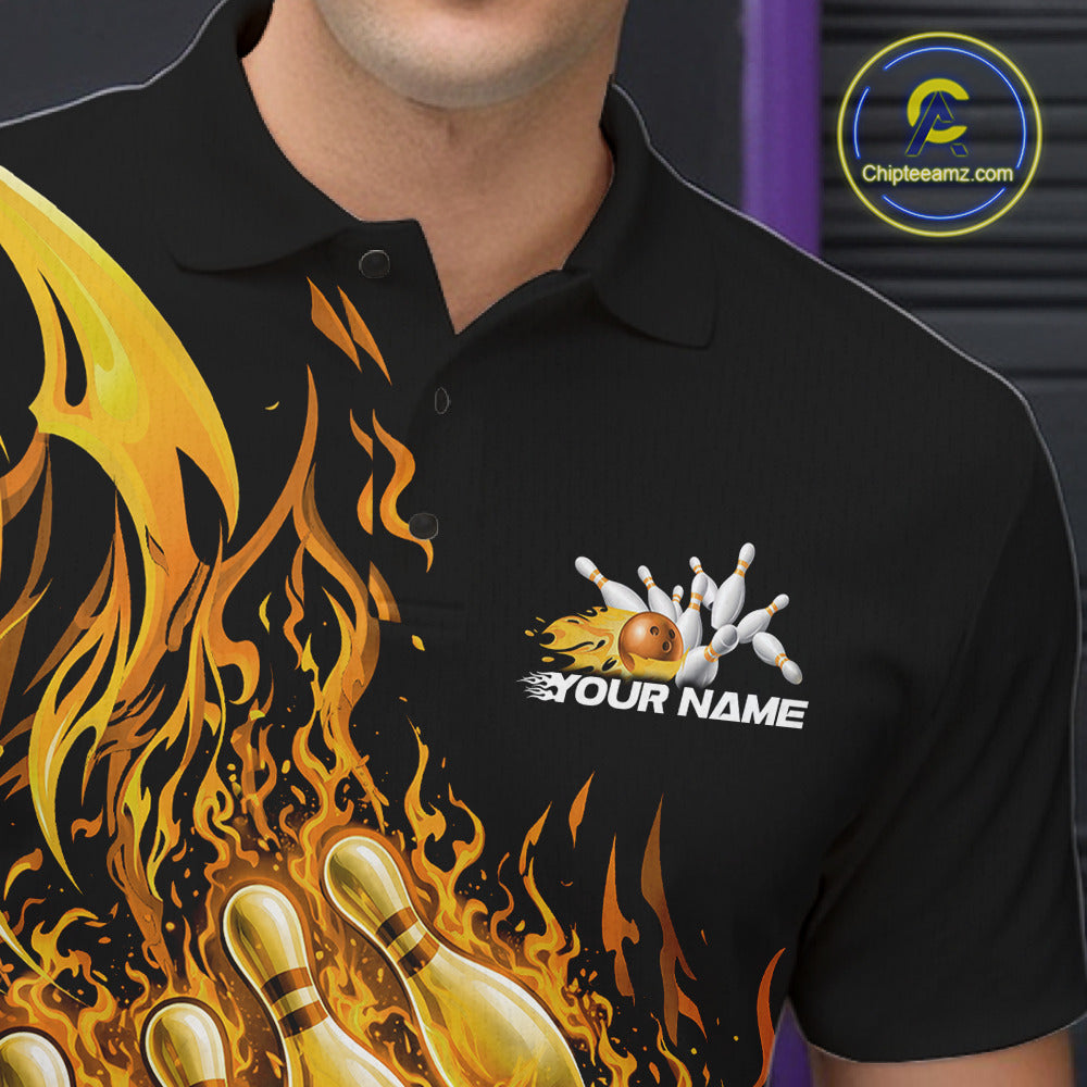 Left chest close-up of a black and yellow bowling polo highlighting a flaming bowling ball knocking down pins.