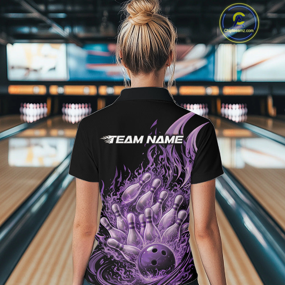 Female model seen from back in a bowling lane wearing a black and purple quarter zip shirt featuring fiery bowling ball crashing through pins with blazing flame artwork.