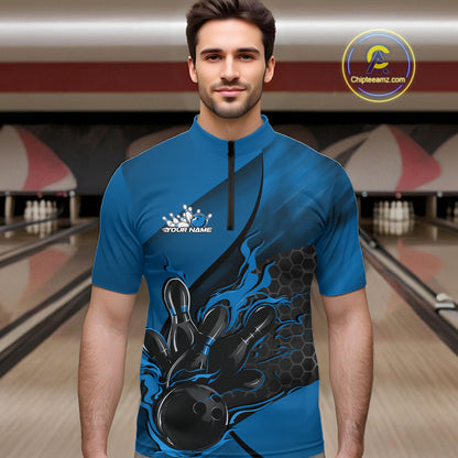 Male model at a bowling lane wearing a black and blue bowling quarter-zip shirt with bowling strike artwork and hexagonal pattern details.