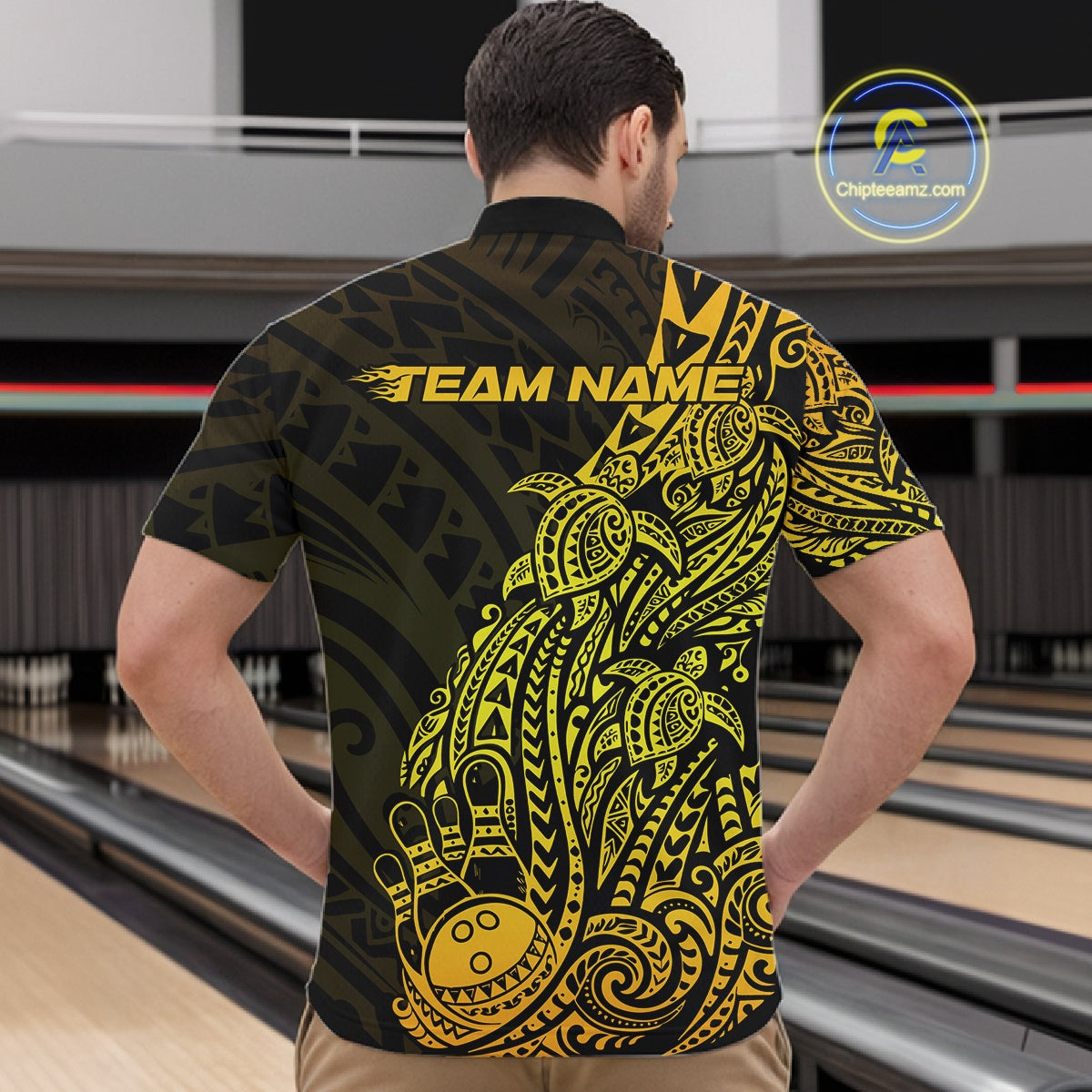 Front view of a male model in a black and gold bowling quarter-zip shirt featuring swirl-accented bowling artwork.