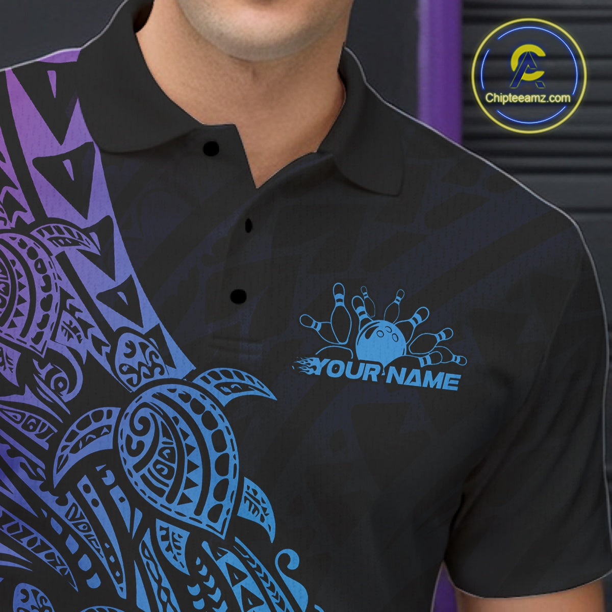 Left chest close-up of a black, blue, and purple bowling polo shirt featuring bowling motifs with Polynesian turtle and swirl details.