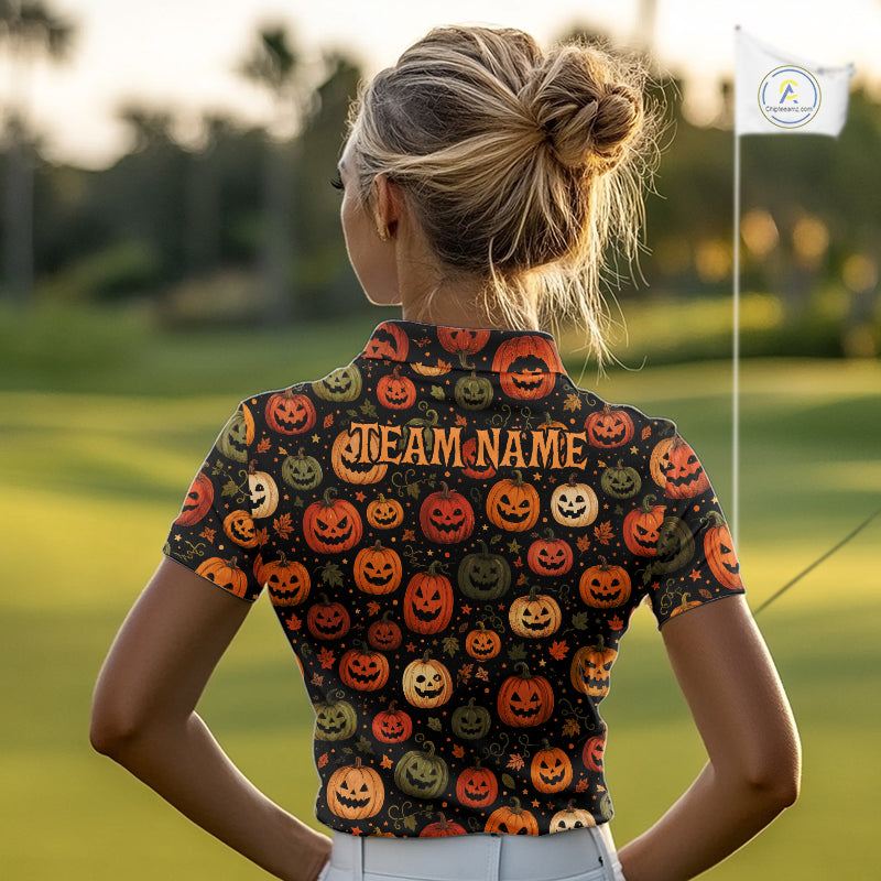 A woman viewed from behind on a golf course, wearing a short-sleeve collared polo shirt with an all-over Halloween pumpkin print and 'TEAM NAME' printed across the back.