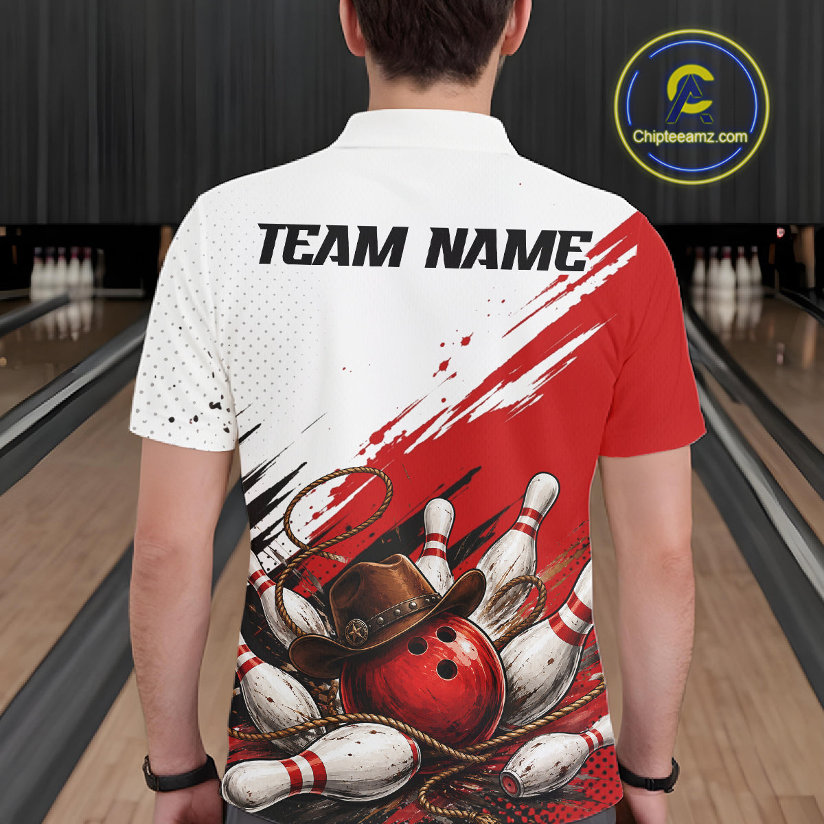 A man viewed from behind wearing a short-sleeve bowling-themed polo shirt with a red and white graphic design featuring bowling pins, a red bowling ball, a lasso, and a cowboy hat. The shirt has 'TEAM NAME' printed on the back.