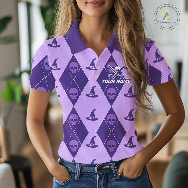 A woman wearing a purple and lavender argyle polo shirt with skull and witch hat patterns, featuring a customizable name print on the chest.
