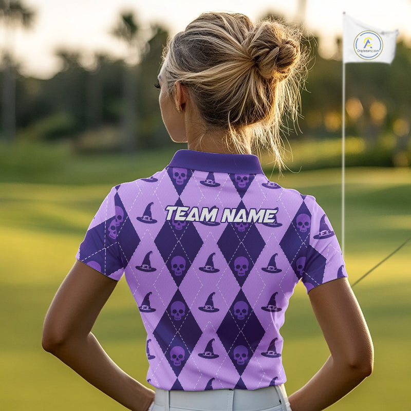 A woman on a golf course seen from behind, wearing a purple and lavender argyle golf shirt with skull and witch hat patterns and 'TEAM NAME' printed across the back.