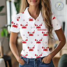 Load image into Gallery viewer, Woman wearing a white polo shirt with red crab patterns and customizable text.