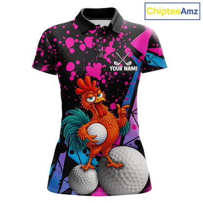 A custom printed short-sleeve polo shirt featuring a cartoon rooster holding golf balls on a black background with pink and blue paint splatters. The shirt includes a black collar and a customizable name patch on the chest.