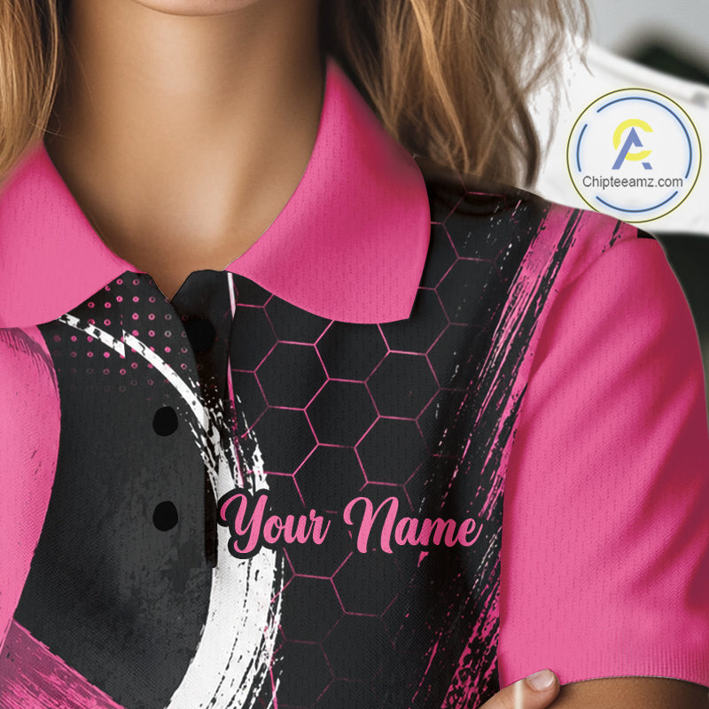 A close-up of a person wearing a short-sleeve polo shirt with a bright pink collar and sleeves, paired with a black vest featuring a pink hexagonal pattern and white brushstroke details. The shirt has 'Your Name' printed on the front, and a circular 'Chipteeamz.