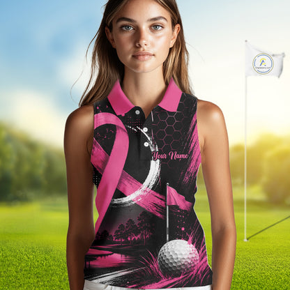 A woman modeling a sleeveless polo shirt with a pink and black golf-themed design, featuring a pink ribbon, golf ball, flag, and the text 'Your Name' on a blurred golf course background.