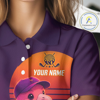 Purple polo shirt with a graphic of a bear wearing a cap and text 'YOUR NAME' on an orange background.
