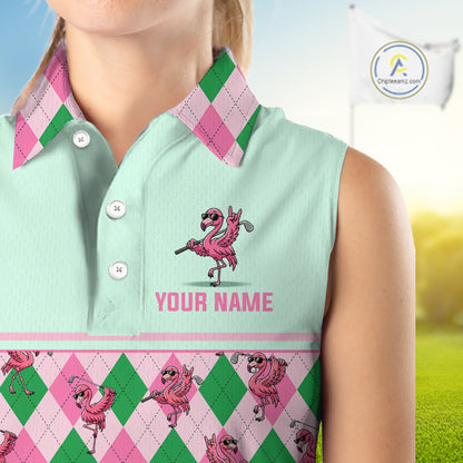 A sleeveless collared polo shirt shown on a cropped model torso, with a mint green body, pink and green argyle collar and lower border, pink flamingo graphics, and the text 'YOUR NAME' on the chest. A golf flag and grass are visible in the background, and a circular 'Designsprint' logo appears in the upper right.