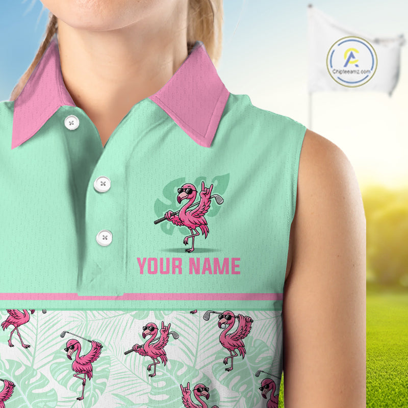 A sleeveless collared golf shirt shown on a cropped model torso, with a mint green upper section, pink collar and text, and a white lower section printed with pink flamingos and green leaves. The shirt includes the text 'YOUR NAME' and a visible 'A Designpoint' logo watermark in the top right.