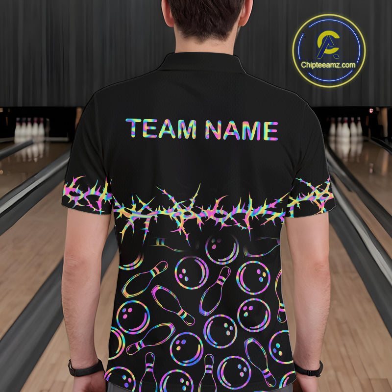 A man viewed from behind wearing a black bowling-themed short-sleeve polo shirt with 'TEAM NAME' printed on the back, a colorful neon thorn pattern across the middle, and bowling pins and balls printed below. The background shows bowling lanes.