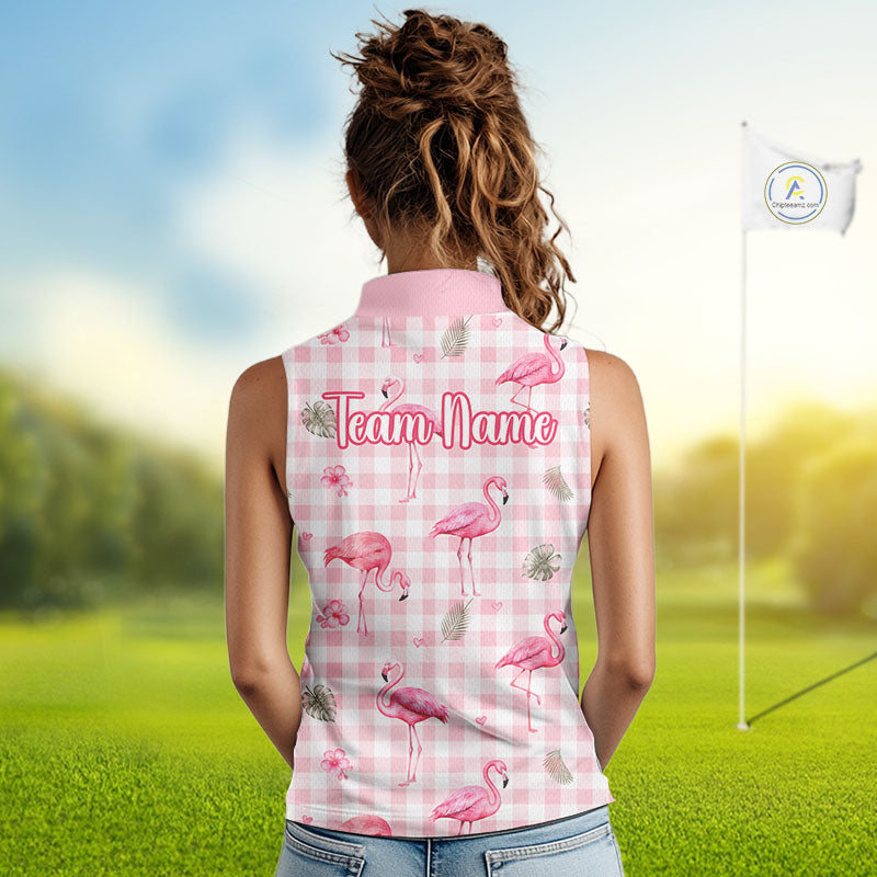 A woman viewed from behind wearing a pink gingham sleeveless polo shirt with a pink flamingo print and 'Team Name' text on the back, standing on a blurred golf course with a flag visible.