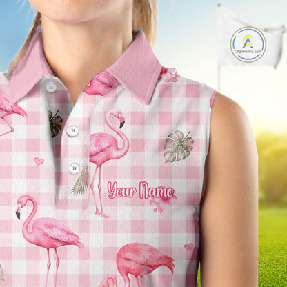 A sleeveless collared polo shirt with a pink and white gingham pattern, decorated with pink flamingos, tropical leaves, and the text 'Your Name'. The shirt is shown on a model against a blurred outdoor background.