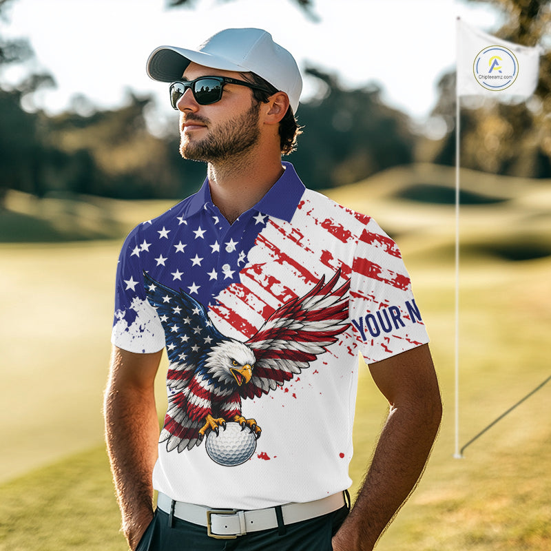 Man wearing a golf shirt with an American flag and eagle design on a golf course.