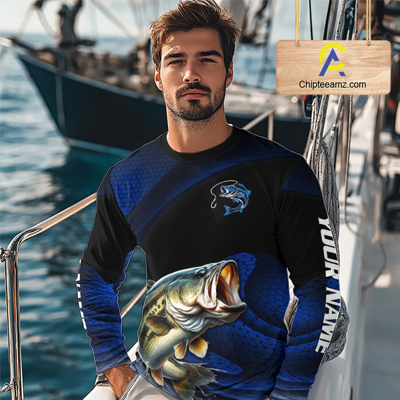 Angler wearing personalized camo bass long sleeve fishing shirt on a boat